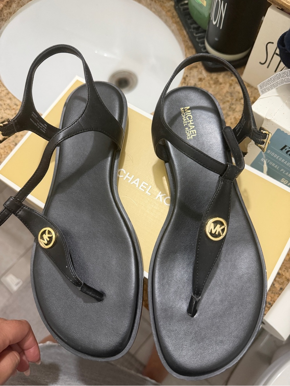 Michael Kors Black Leather T-Strap Sandals with Gold MK Medallions